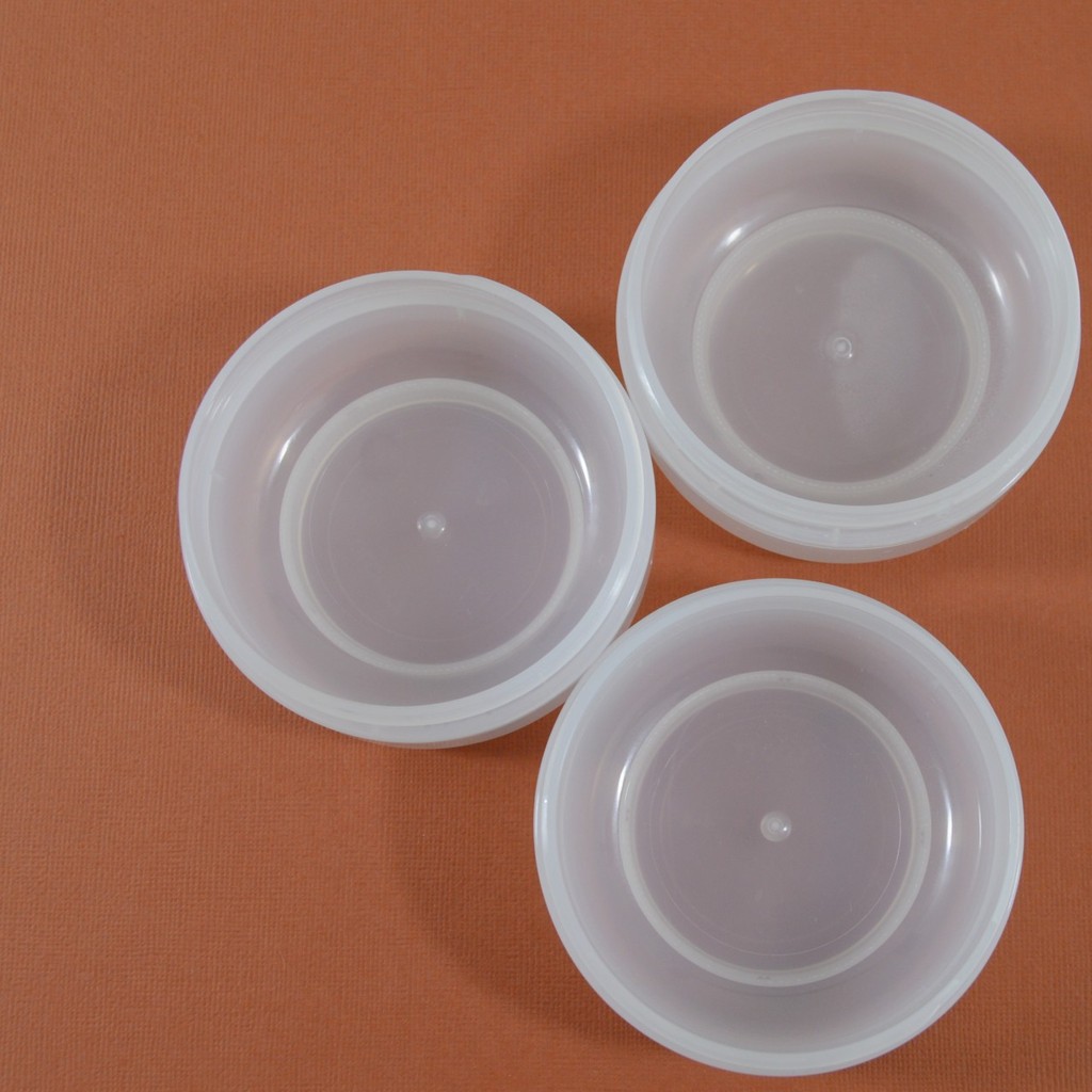3 double ounce jars on orange background 
