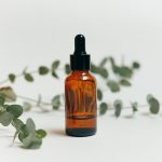 A professional apothecary shot of an amber glass bottle labeled 
