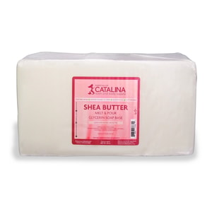 A large, 20-pound solid block of opaque white melt and pour soap tightly wrapped in clear plastic, featuring a pink Essentials by Catalina label.