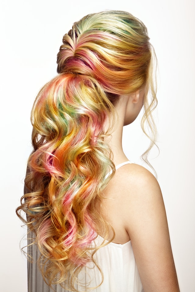 Beauty fashion model girl with colorful dyed hair