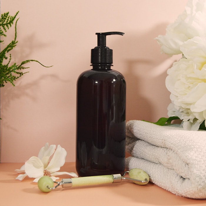 Mother's Day 2025 Lotion bottle with roller in a spa setting 