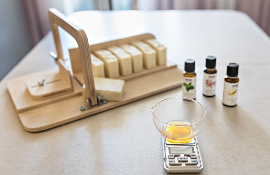 a-soap-maker-weighs-aromatic-oils-for-making-cosme-2023-11-27-04-59-38-utc